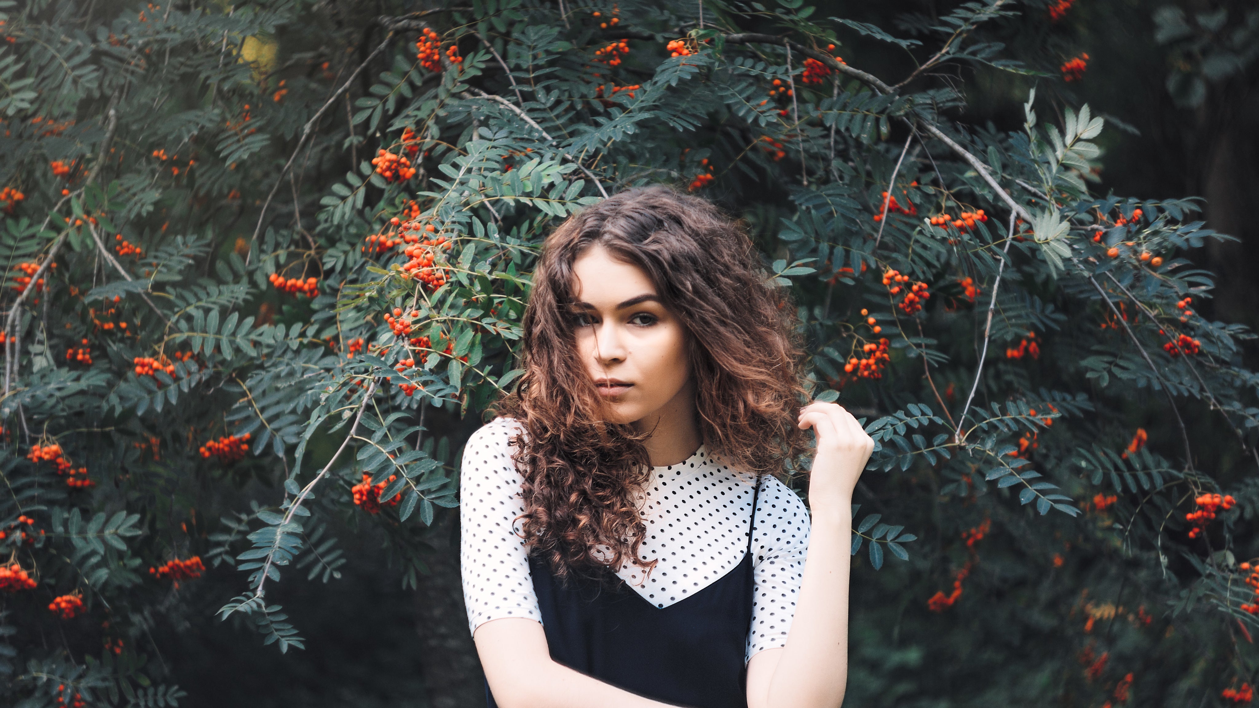 woman-infront-of-tree-with-berries.jpeg